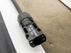 Close-up of MC4 connector showing 'Do not disconnect under load' safety text molded into the connector body