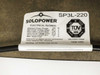 Close-up of SoloPower SP3L-220 electrical ratings label showing Pmax 220W, Vmp 65.1V, Imp 3.40A, Voc 91.8V, Isc 4.40A, Max Series Fuse 7A, Max System Voltage 1000 VDC, with TÜV SÜD certification mark