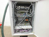 Amtec XRF 940V internal cabinet view — upper section showing dense cable routing, control boards, and cooling components