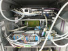 Amtec XRF 940V internal detail — top rack section with PC board, VGA and serial connectors visible on rear of embedded computer