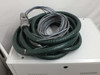 Amtec XRF 940V measuring head cable assembly — large green flexible conduit with multi-conductor signal cable coiled on cabinet top