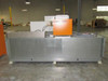 Deltatherm HYD11-100 rear/side view showing stainless steel duct housing with multiple round duct outlet ports and orange chiller unit
