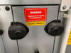 HYD11-100 Droplet Eliminator section door with red standstill-only warning label and black quarter-turn fasteners