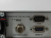 Paradise Datacom P300 rear panel left section — serial number label, Station Clock BNC connector, 1-for-1 DB9 port, and Remote DB9 port