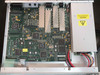 Paradise Datacom P300 interior view — main PCB with multiple ICs and daughter cards, internal power supply visible on right side
