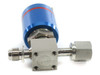 Flowlink GAZ 1146203 pneumatic gas valve angled rear view showing stainless steel valve block body with FLOWLINK markings, male fitting and compression nut on opposite ends