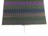 Close-up of Solopower SP1 CIGS solar cell string showing iridescent purple and green thin-film cell rows with output wire leads at bottom edge