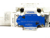 Yuken DSG-01-3C40-D24 directional valve — close-up of blue nameplate label reading DSG-01-3C40-D24-50398, Yuken Kogyo Co. Ltd., Japan, SOL a and SOL b markings