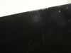 Close-up of iMac display glass top-right corner showing additional chips and flaking along glass edge