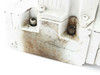 Moog J661B173A servo valve – close-up of underside hydraulic port face showing heavy surface rust, staining, and two port fittings