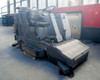 Nilfisk-Advance 3800 Rider Floor Scrubber Sweeper – right-front three-quarter view showing scrub deck, side brush, and operator seat