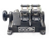 Moviola SYB synchronizer – right-side view showing both gang sprocket assemblies, film guide arms raised, and nameplate on cast iron body