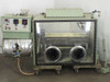 Vacuum Atmospheres VAC single-width glove box with conveyor system – front view showing dual glove ports, large viewport, and control panel to the left
