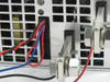 Mean Well RSP-3000-48 close-up of CN1 and CN2 connectors and V+/V- output stud terminals — red loop wire visible on CN1 black connector for local operation mode
