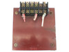 Top-down view of open frame transformer showing multi-position screw terminal block with wire leads and red metal top plate