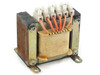 Open frame laminated core power transformer angled rear-right view showing red secondary winding leads routed to screw terminal block