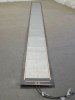 Uni-Solar PVL-136 flexible solar panel laid flat and fully unrolled showing full panel length with copper bus bars