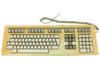 Digital Equipment LK201 terminal keyboard front view showing full key layout with yellowed casing and coiled RJ11 cable