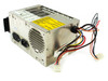 IBM 6447192 AT power supply — left-rear angled view showing IEC AC inlet connectors, fan vent, multi-wire output harness with Molex and AT motherboard connectors, and yellow rating label