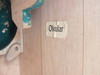 Interior wooden case wall showing printed 'Okular' label for eyepiece storage position