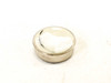 Bottom face of Dallas DS1982U-F5 iButton showing smooth stainless steel contact surface with light adhesive residue
