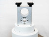 Bruker Z49485 TFL Support 2M KPL — close-up of upper aluminum clamping bracket with circular bore, four star-knob fasteners, and circular mounting flange with screws