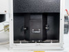 OAI 0130-041-04 – interior lower compartment view showing lamp carriage, adjustment knob, and mounting rails inside the black-lined lamp chamber