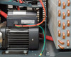 Haskris LX3-A2 – close-up of Grundfos circulation pump motor with CE marking, adjacent to copper tube heat exchanger coil, inside unit