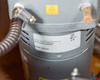 Jun-Air 2000-25M – rear output port area showing two large brass hex fittings