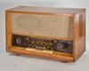 Grundig 3025/S — straight-on front view showing speaker grille cloth, tuning dial, and Hi-Fi Klang-Register keys