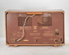 Grundig 3025/S — rear view showing brown phenolic back panel, ventilation holes, Grundig logo, and power cord