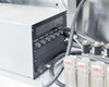 Close-up of internal controller sub-chassis with multiple rotary control knobs (labeled Load 1A, Load 2A, etc.) and adjacent Dwyer rotameter bank with solenoid valve heads