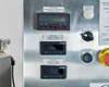 ASI imPULSE control panel detail — Digi-Helic differential pressure controller (PC400160), Red Lion mixer speed panel meter (SI501160), Red Lion process temp panel meter (TI501080), system power on knob, emergency stop button