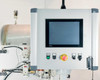 NI TPC-2230 touchscreen control panel enclosure showing touchscreen display, emergency stop button, and control switches mounted on aluminum extrusion frame
