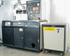 CHA Industries SEC-600 system front view — main black cabinet with panels, Airco Temescal control rack, and separate beige power unit on casters