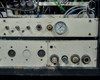 CHA Industries SEC-600 gas manifold panel — Gas 1–4, Vent, Air Out, Air In fittings with pressure gauge; wear and corrosion visible on panel surface
