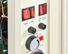 Grumbach incubator control panel close-up showing Power and Light rocker switches, Humidity/Thermo Control toggle switches, coarse and fine temperature knobs, and humidity regulator dial