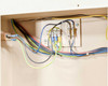 Grumbach incubator internal wiring terminal block close-up showing multi-color wire connections (blue, green/yellow, black) and fuse/terminal strip