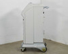 Lumenis Novus Varia floor console – left side profile view showing mobile caster base and arm mount bracket
