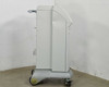 Lumenis Novus Varia floor console – right side profile view showing mobile caster base, yellowed front caster, and arm mount bracket