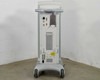 Lumenis Novus Varia rear view showing ventilation grille, connection panel with fiber ports and circular connectors, power inlet area, and mobile caster base
