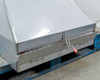 Fantech FKD 16XL filter hood base showing latch mechanism and filter access panel on lower edge
