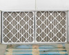 Dual pleated panel air filters included with Fantech FKD 16XL filter hood – shown removed from hood