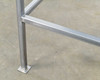 Close-up of square steel leg and flat footing cap at floor level