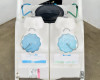 Ecolab EZBlend Boost Foam Unit – top-down view of dual solution tanks with blue screw caps and chained lids open, Ecolab labels visible