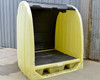 ULine H-5737 4-drum spill containment shed – front three-quarter view, roll-up door open showing interior grating and sump basin