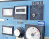 Beckman L5B-CT control panel close-up showing vacuum-in-microns gauge, program G display, rotor revolution counter reading 0105528, RPM-in-thousands meter, and speed control knob