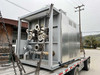 Nabertherm NR 1000/11 vacuum furnace rear section on flatbed showing vacuum pump manifold, large flanged vacuum ports and associated plumbing