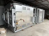 Nabertherm NR 1000/11 hot wall retort vacuum furnace full system view with gas manifold and control enclosures, indoor storage