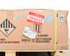 End panel of LG Chem RESU10H box showing Fragile sticker, 9.8kWh energy label, UN certification code 4G/Y130/S/20/ROK/KOMDI, manufacture date 2020-12, and hazmat class 9 diamond
